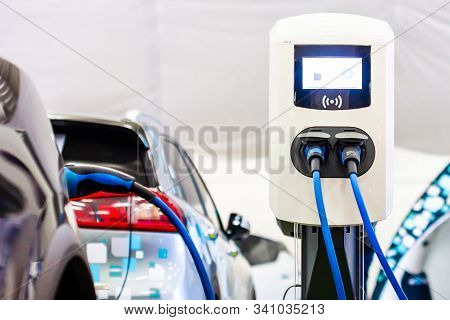 Modern Electrical Fast Charger To Electrical Or Hybrid Phev Automobiles. Future Energy Power. Ecolog