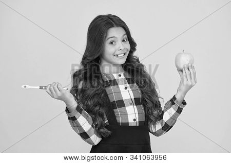 Brush Teeth Right Way. Happy Child Hold Tooth Brush And Green Apple. Teaching Oral Hygiene. Dental H
