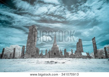 Ruined Ancient Buddhist Temple And Pagoda In Ayutthya Historical Park, Thailand In Infrared Photogra
