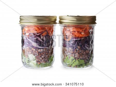 Glass Jars With Healthy Meal Isolated On White