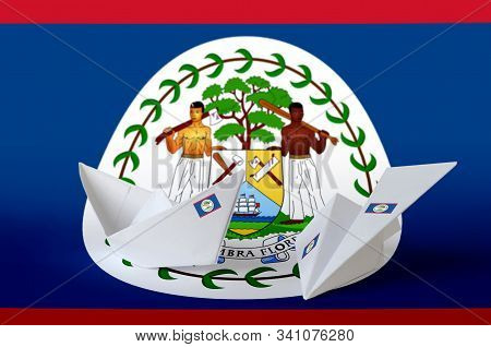 Belize Flag Depicted On Paper Origami Airplane And Boat. Handmade Arts Concept