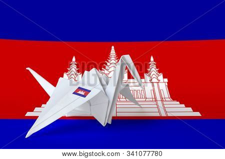 Cambodia Flag Depicted On Paper Origami Crane Wing. Handmade Arts Concept