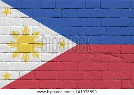 Philippines Flag Depicted In Paint Colors On Old Brick Wall. Textured Banner On Big Brick Wall Mason