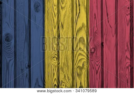 Chad Flag Depicted In Bright Paint Colors On Old Wooden Wall. Textured Banner On Rough Background