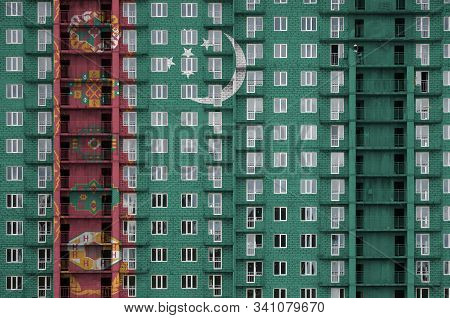 Turkmenistan Flag Depicted In Paint Colors On Multi-storey Residental Building Under Construction. T