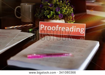 Proofreading English Card Over Blurred Text On Black Table