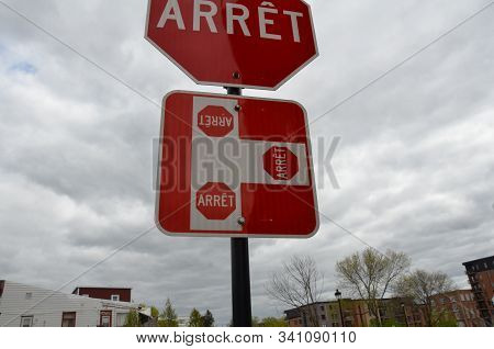 Three Way Stop Or Arret Sign In Canada