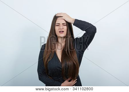 Sick Caucasian Woman Over Isolated Gray Background Wearing Casual Black Dress With White Polka Dot, 