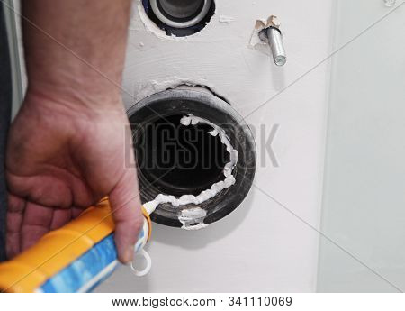 Close Up With Installing Built-in Toilet In House Bathroom. Flush Built-in Toilet.