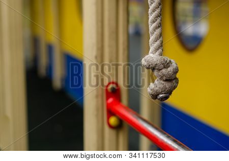Climbing Rope In The Playground. Close-up Of A Knot On A Climbing Rope. Children Playground. Selecti