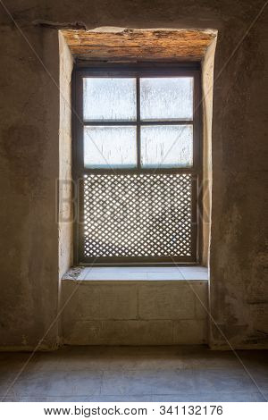 Single Interleaved Grunge Wooden Ornate Window - Mashrabiya - In Stone Wall At Abandoned Building, M
