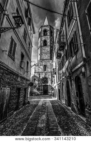 Alghero Duomo At The End Of A Narrow Alley In Old Town Alghero. Sardinia, Italy