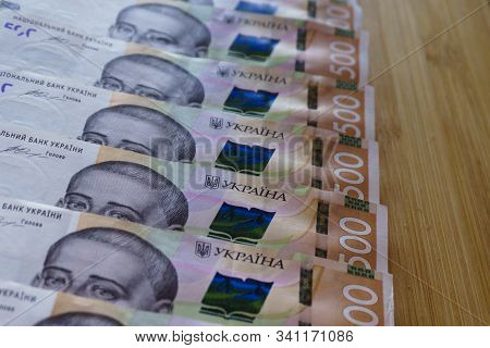 Crolled Stack Cash Money 500 Hryvnia. Ukrainian National Currency Bills Money On Table. Close Up Fin