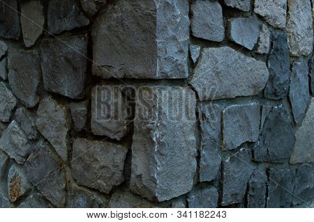 Corner Of A Wall Lined With Boulders Close Up