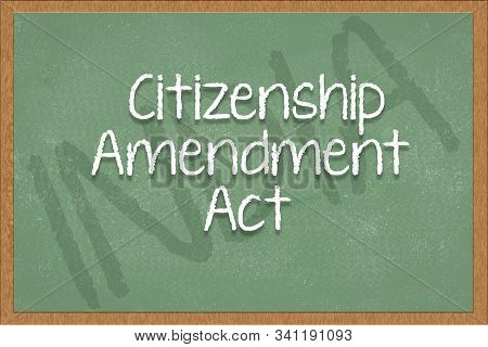 Citizenship Amendment Act Written On Green Black Board With India As A Background.