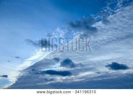 Beautiful White Clouds On Blue Sky Background. White Clouds On Boundless Sky. Blue Sky With White Cl