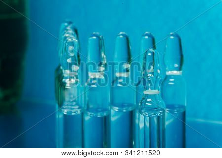 Glass Medical Ampoule Vial For Injection. Medicine Is Liquid Sodium Chloride With Of Aqueous Solutio
