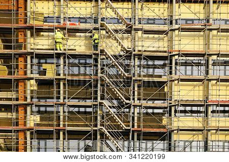Scaffolding Arround The House To Install Thermal Insulation Of The Apartment Building Facade