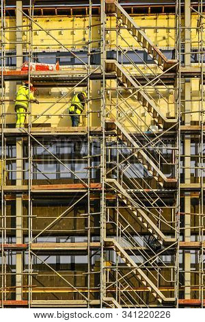 Scaffolding Arround The House To Install Thermal Insulation Of The Apartment Building Facade