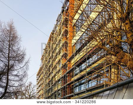 Scaffolding Arround The House To Install Thermal Insulation Of The Apartment Building Facade