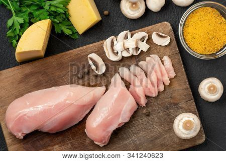 Slicing Chicken Breast Fillet For Cooking With Champignons And Cheese, Top View