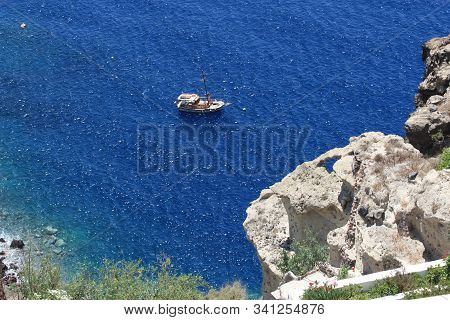 Boat At Sea By The Really Beautiful Cliff