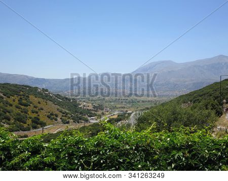 Beautiful Panorama Of Stone Mountains, Trees And Blue Sky