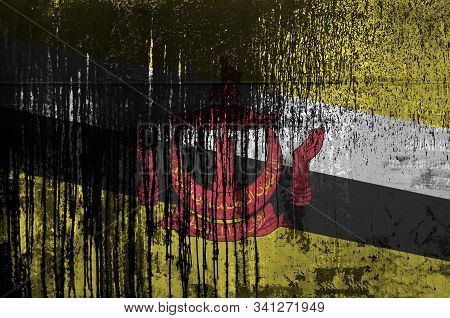 Brunei Darussalam Flag Depicted In Paint Colors On Old And Dirty Oil Barrel Wall Closeup. Textured B