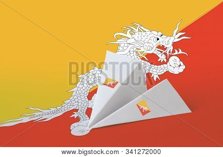 Bhutan Flag Depicted On Paper Origami Airplane. Handmade Arts Concept