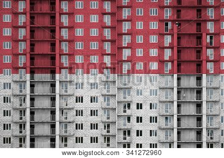 Indonesia Flag Depicted In Paint Colors On Multi-storey Residental Building Under Construction. Text