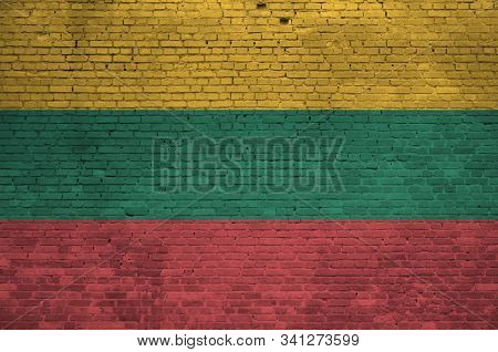 Lithuania Flag Depicted In Paint Colors On Old Brick Wall. Textured Banner On Big Brick Wall Masonry