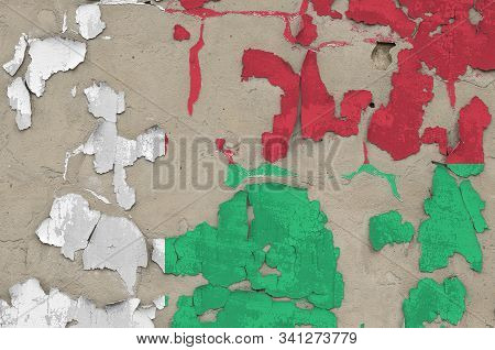 Madagascar Flag Depicted In Paint Colors On Old Obsolete Messy Concrete Wall Closeup. Textured Banne