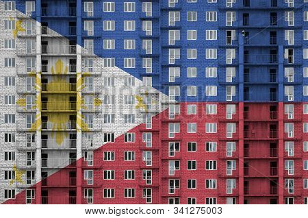 Philippines Flag Depicted In Paint Colors On Multi-storey Residental Building Under Construction. Te