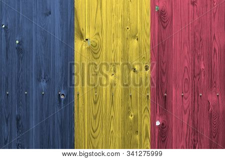 Chad Flag Depicted In Bright Paint Colors On Old Wooden Wall. Textured Banner On Rough Background