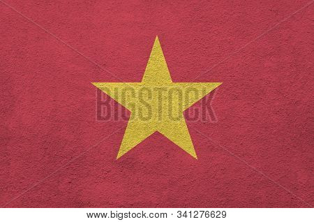 Vietnam Flag Depicted In Bright Paint Colors On Old Relief Plastering Wall. Textured Banner On Rough