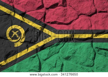 Vanuatu Flag Depicted In Paint Colors On Old Stone Wall Closeup. Textured Banner On Rock Wall Backgr