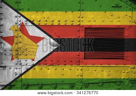 Zimbabwe Flag Depicted On Side Part Of Military Armored Tank Closeup. Army Forces Conceptual Backgro