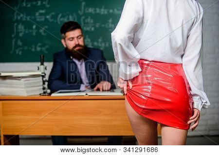 Passion For Knowledge. Woman Strip With Passion In Class. Sexy Female Buttocks In Red Leather Skirt.