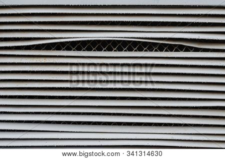 Vandal-proof Protective Metal Shutters. Curved Massive Blinds With Additional Metal Mesh. Protection