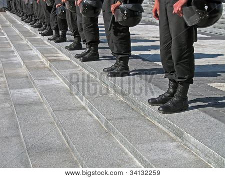 Police Cordon In Black Uniform With Hard Hat (helmet), Modern Security Details