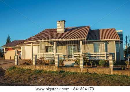 Cambara Do Sul, Brazil - July 16, 2019. Charming Modern Townhouse With Fence And Garden At Sunset, I