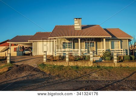 Cambara Do Sul, Brazil - July 16, 2019. Charming Modern Townhouse With Fence And Garden At Sunset, I
