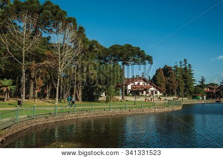 Gramado, Brazil - July 21, 2019. Wooded Park With The Joaquina Rita Bier Lake And House In German-in
