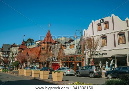 Gramado, Brazil - July 21, 2019. Buildings With Shops And People On Causeway At Borges De Medeiros A