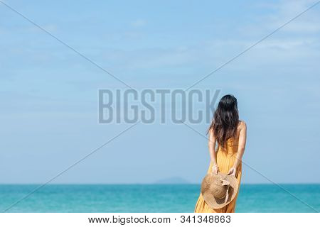 Summer Holiday. Lifestyle Woman Chill Holding Big White Hat And Wearing Yellow Dress Fashion Summer 