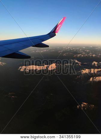 Bavaria, Germany - June 28, 2019: Airbus A321 Plane Of Wizz Air Flying Over Alps Mountains. Wizz Air