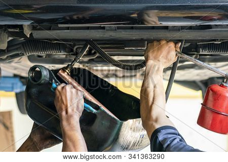 Repairman Or Mechanic During Use Inject Gun Flush Oil For Cleaning In Inside Cooling Tube For Modify