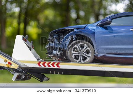 Accident Car Slide On Truck For Move. Blue Car Have Damage By Accident On Road Take With Slide Truck