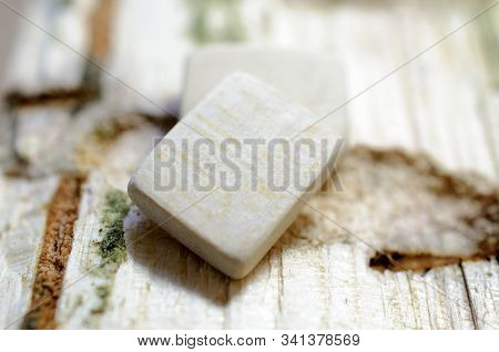Wooden Clean (empty) Rune Close-up On A Wooden Background. Soft Focus