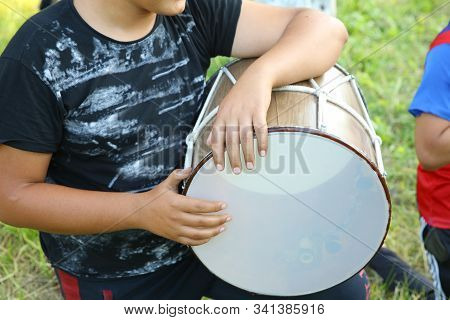 The National Instrument Of Azerbaijan Nagara . Children In National Costumes Play Drums . Young Azer